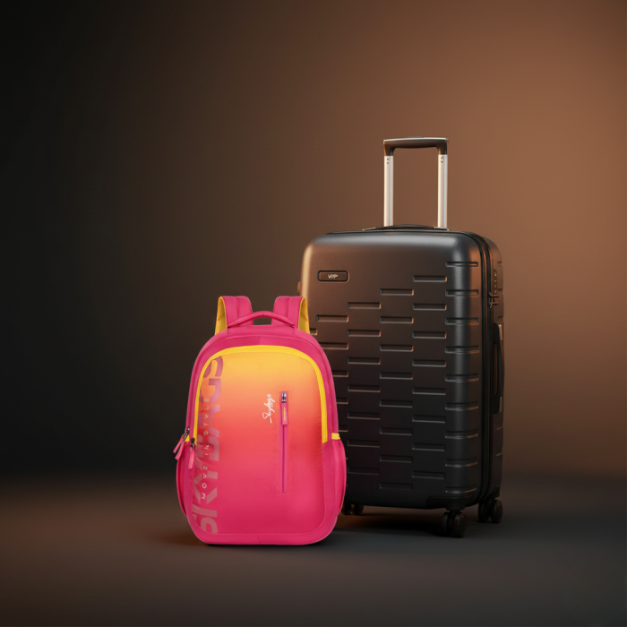 Pink Skybags backpack beside a black hard-shell suitcase