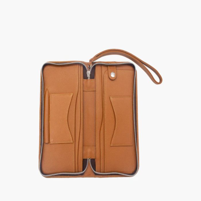 Tan travel wallet with zip, open to show card and passport slots